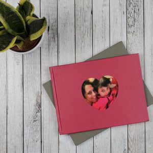 love photobook with red heart cut out window